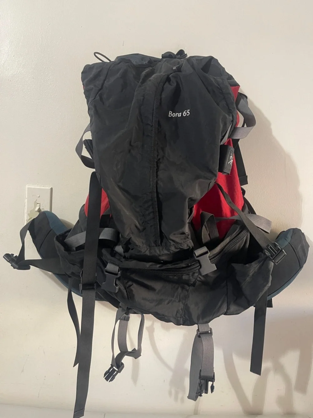 Arc'teryx Black and Red Backpack with Gray Straps